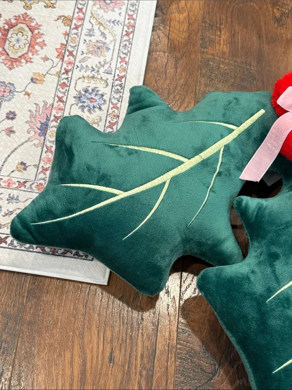 Green Holly Leaf Throw Pillow Pair with Red Pom Accents